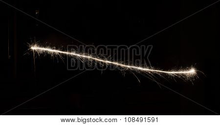 sparkler light trail in dark environment using slow shutter speed
