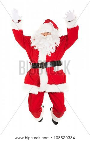 Happy cheerful Santa Claus jumping