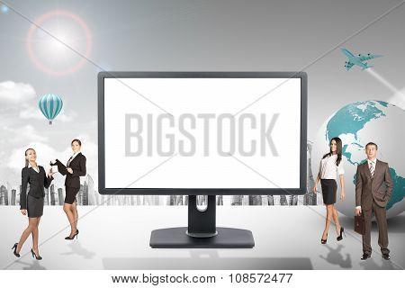 Buisnesspeople with blank screen monitor