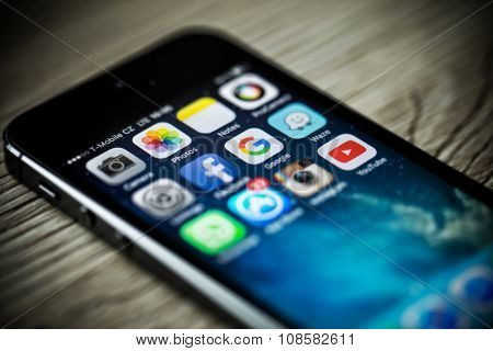 PRAGUE, CZECH REPUBLIC - NOVEMBER 17, 2015: A close-up photo of Apple iPhone 5s start screen with apps icons.