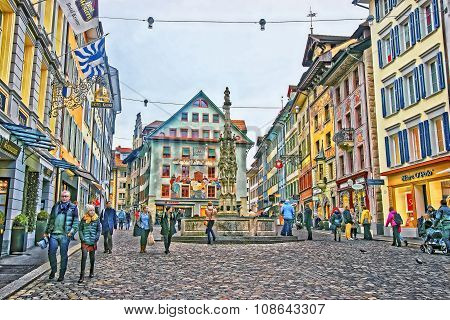 LUCERNE SWITZERLAND - JANUARY 04 2015: Unidentified tourists at picturesque square Muhlenplatz with its historical buildings decorated with frescos. Lucerne Switzerland