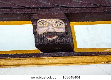 LIMBURG, GERMANY - JAN 4, 2012: wood carving and colored on balk timber of old framework houses
