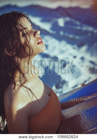 Beautiful young woman in fashion clothes on sand quarry