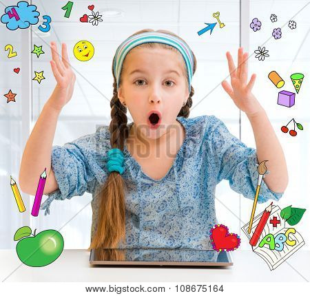 Happy little girl and her magic tablet