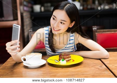 Girl In Cafe Shop Texting On Smartphone
