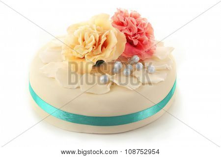 Cake with sugar paste flowers, isolated on white