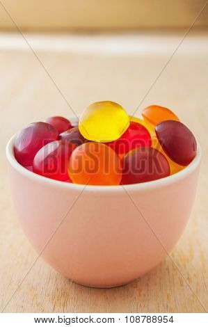Colorful Candy In A Bowl On Wooden Background