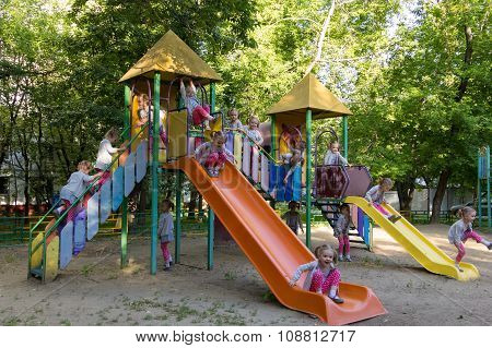 Fifteen Clones Of Cute Girl At Children Playground