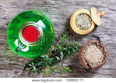 Therapeutic Herbal Tincture, Alternative Medicine, Love Potions, Dried Herbs On A Wooden Table.