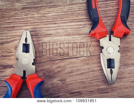 pliers on wooden