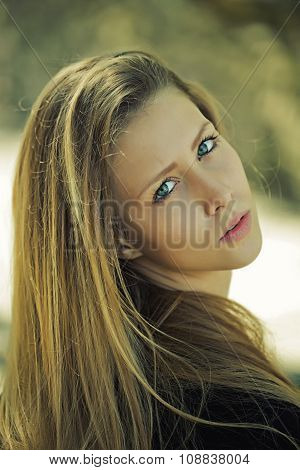 Attractive Blond Girl Looking Backwards