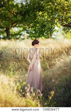 Beautiful bride in fashion dress in the garden