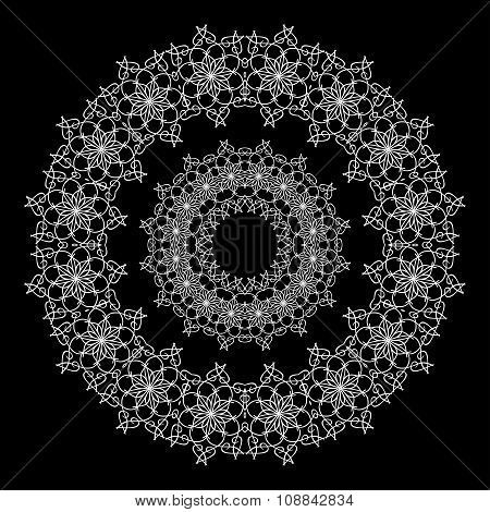 Circular White Lace Ornament on Black Background