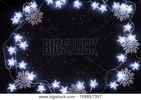 Stars And Snowflakes On The Night Sky