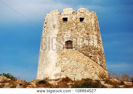 Spanish ancient tower in the coast with vivid blue sky back for tourism