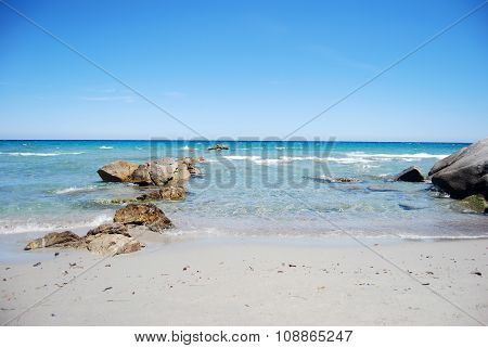 landscape with coastal sea shore waves crystal clear water and rocks and clear sky as wounderful image