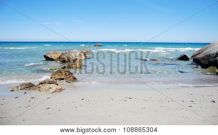 Landscape With Coastal Sea Shore, Waves, Crystal Clear Water And Rocks And Clear Sky