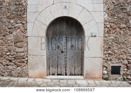 Heavy Wooden Door As House Entrance In Valdemossa, Mallorca, Spain.