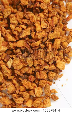 heap of salty pork greaves (top view)