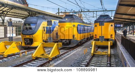 Three Fast Intercity Commuter Trains Waiting At A Station