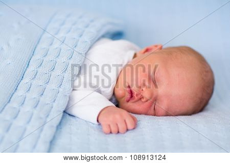 Newborn Baby Boy On A Blue Blanket