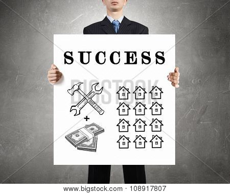 Businessman holding banner with drawn money earning concept