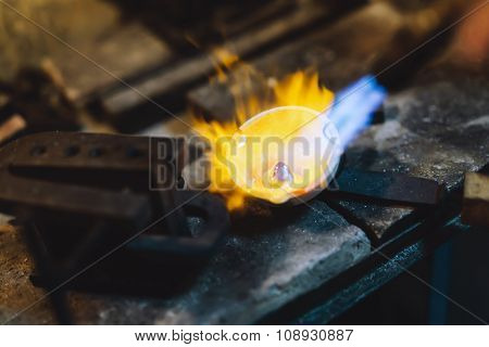 Jeweler Melting Gold