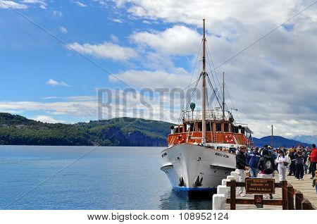 Tourists Boat At The Pier In Lake Nahuel Huapi
