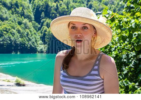 Amazed young tourist looking at something