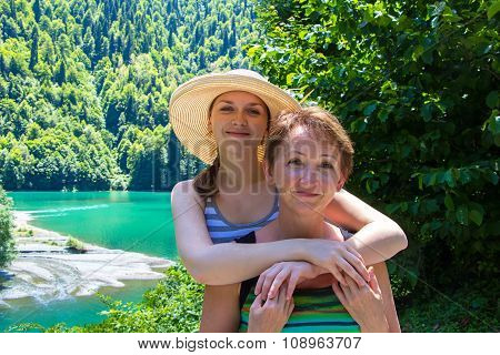 Happy smiling hugging tourists