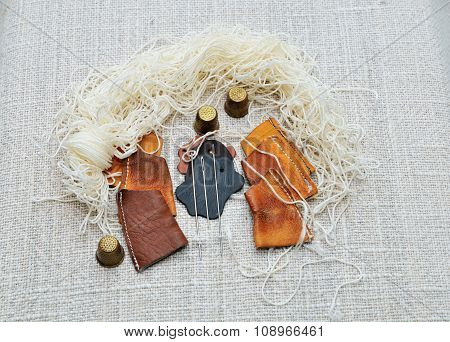 Set for a cobbler to sew moccasins.