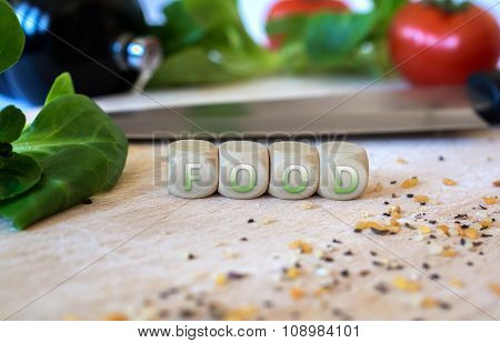 Knife, Salad, Cubes And Spices On A Chopping Board