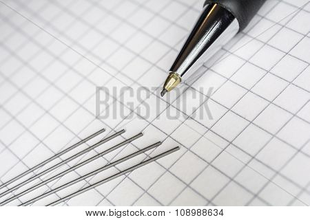 Macro Of A Mechanical Pencil With 5 Leads On Squared Paper 1