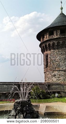 The inner yard with a fountain and tower at the Wernigerode Castle in Germany