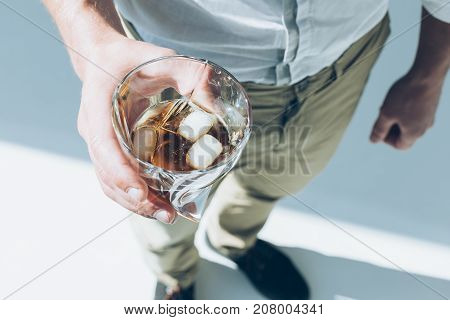 Man Holding Whiskey With Ice