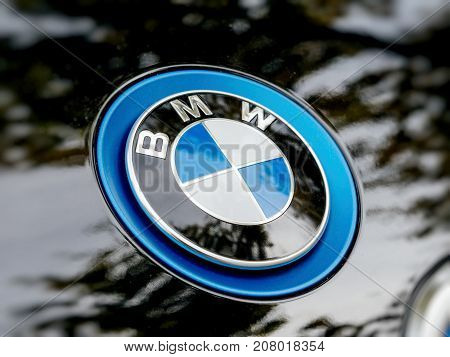 STRASBOURG FRANCE - MAY 30 2017: Side view of blue BMW logotype on the electric i1 limousine