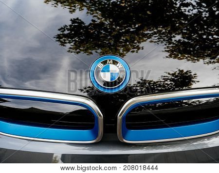 STRASBOURG FRANCE - MAY 30 2017: Front view of blue BMW logotype on the electric i1 limousine