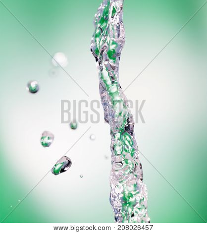 a jet of water on a green background