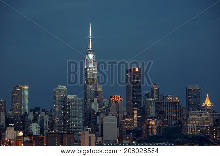 NEW YORK CITY - JUL 4: Empire State Building with skyscrapers on July 4, 2015 in Manhattan, New York City. With population of 8.4M, it is the most populous city in the United States.