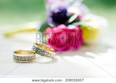 The wedding rings with flowers, marriage concept.