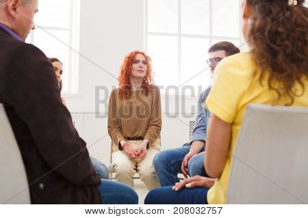 Meeting of support group. Young woman therapist listening to other people. Mental health, psychotherapy concept