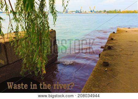The riverscape of large drainage steel pipe background. concept of industrial wastes and environmental pollution