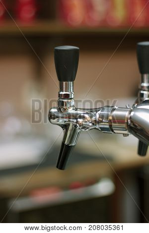 Beer faucet on bar ready to fuel a beer
