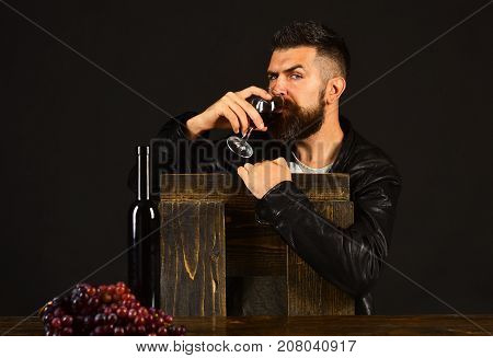 Winetasting And Degustation Concept. Man With Beard Holds Wineglass
