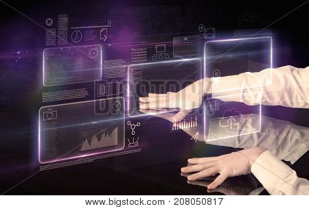 Male hands touching interactive table with purple cloudspace graphic on it 