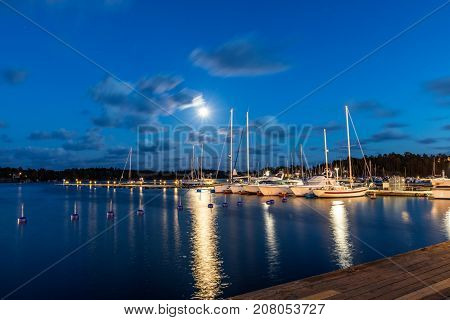 Sailing Boats And Yachts In Marina At Night. Nynashamn. Sweden.