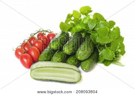 vegetables cucumbers and tomatoes on a white background