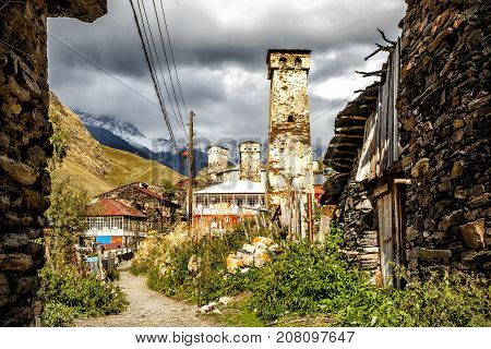 Street in Ushguli village at the foot of Mt. Shkhara. Location place Lamaria Upper Svaneti, Georgia, Europe.