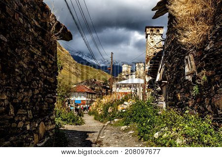 Street in Ushguli village at the foot of Mt. Shkhara. Location place Lamaria Upper Svaneti, Georgia, Europe.