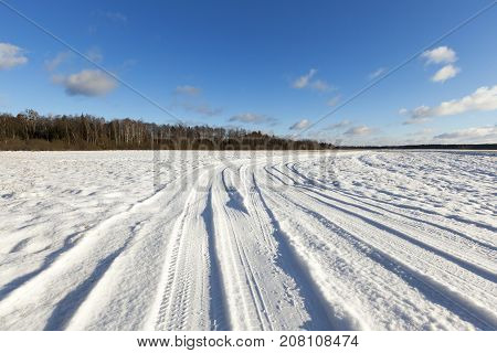 Small Road In Winter With Ruts From The Tires Of Cars. On The Ground There Is Snow After Snowfall. B
